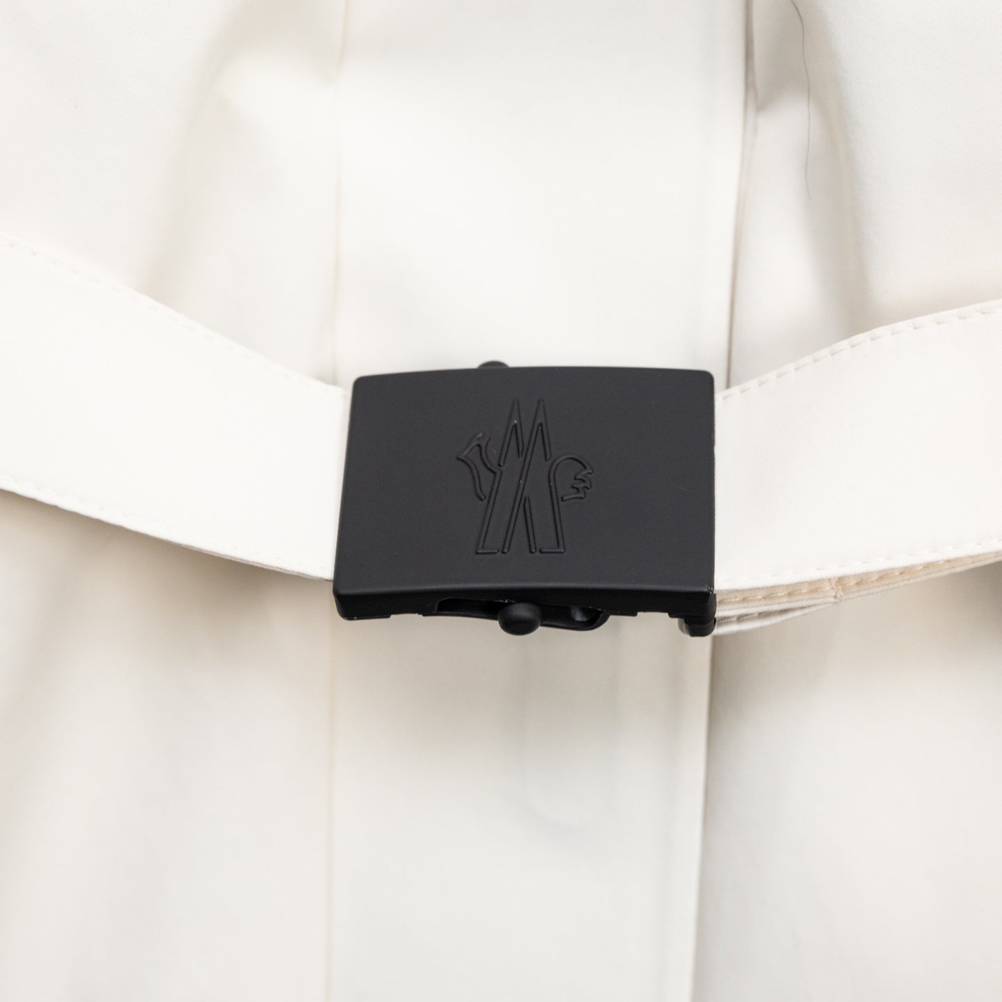 Moncler long coat interior snap cover with Moncler logo