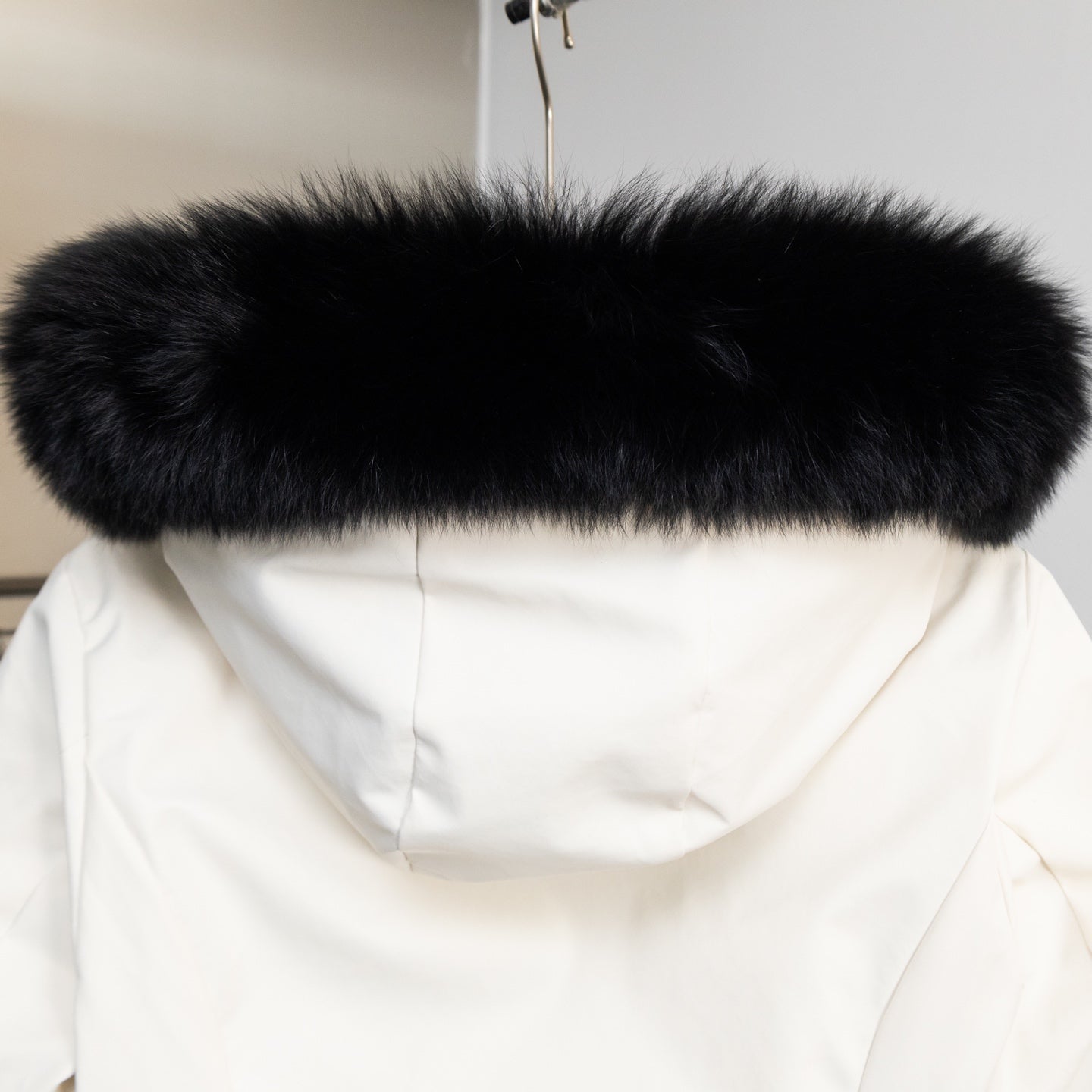 Moncler long coat with dark fur trimmed hood