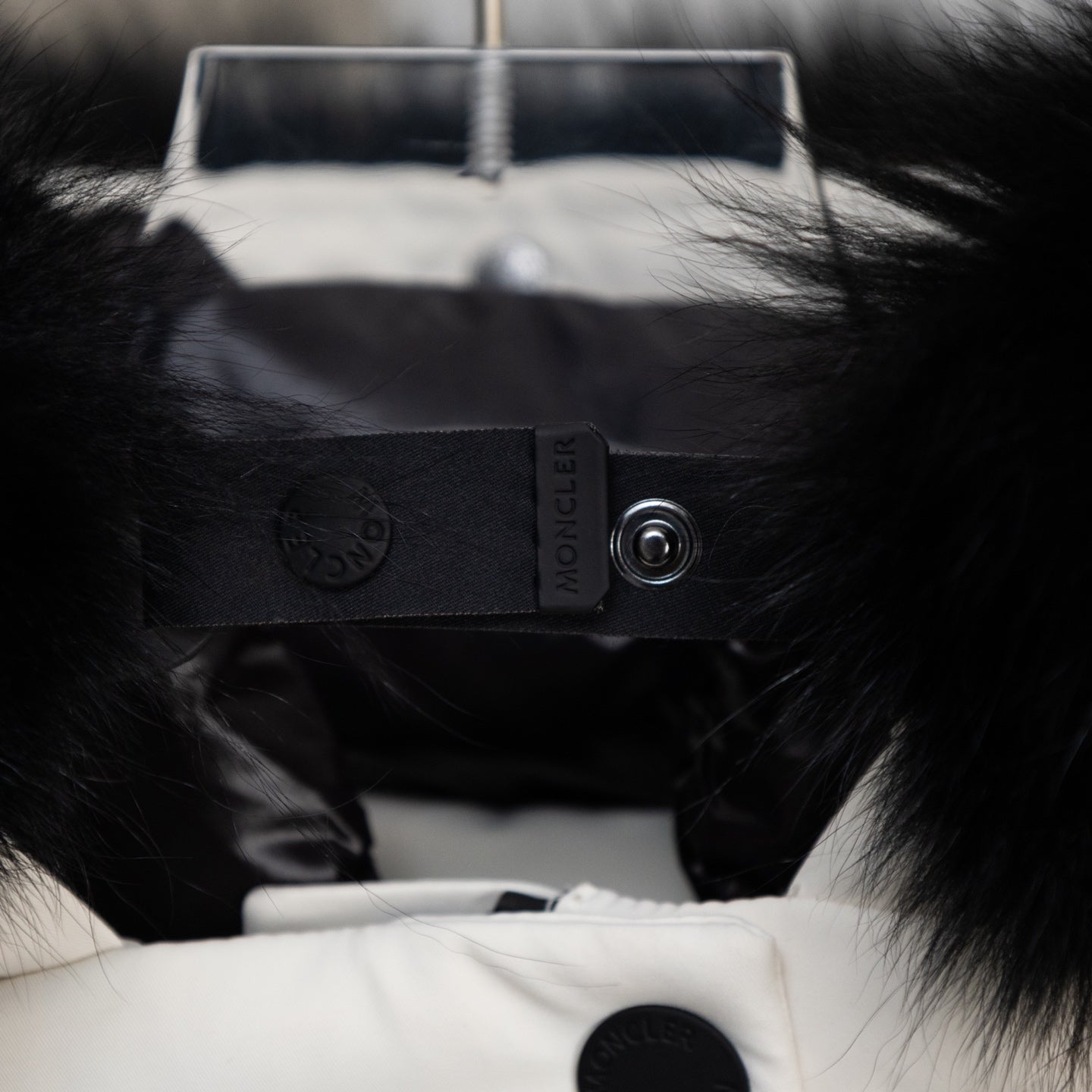 Moncler black inner hood label with snap and logo stamp