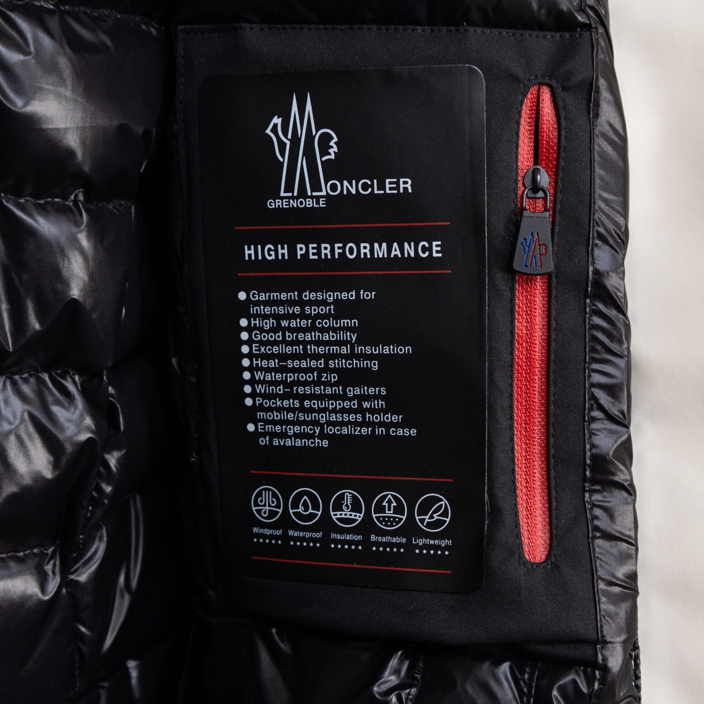 Moncler long coat interior technical label with red zipper pocket