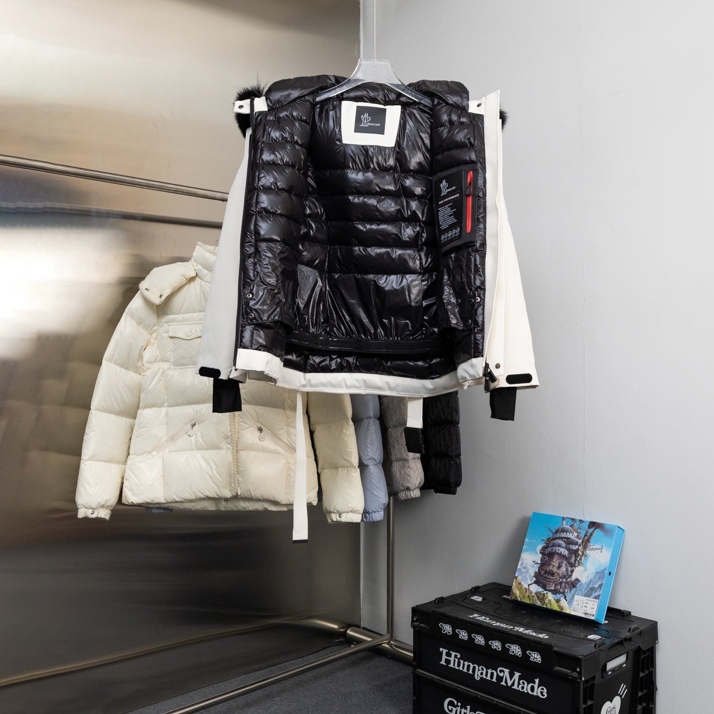 Moncler long black puffer jacket with hood and quilted inner lining
