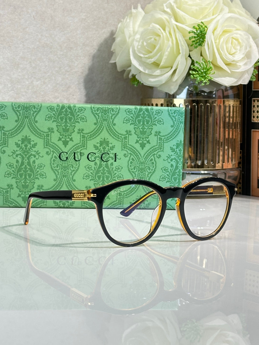 Eyeglasses display with tortoise brown frames and clear lenses