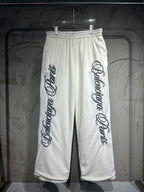 Balenciaga sweatpants, white with black vertical logo print on both legs, elastic waist