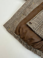 Houndstooth jacket interior with monogram lining and buttoned front placket