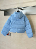 Light blue puffer jacket with hood, back quilted panels