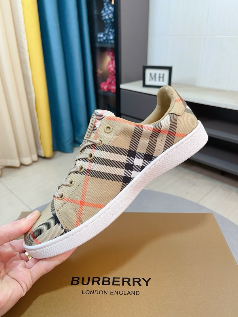 Beige plaid low-top sneakers with lace-up ties, logo label, and white rubber sole