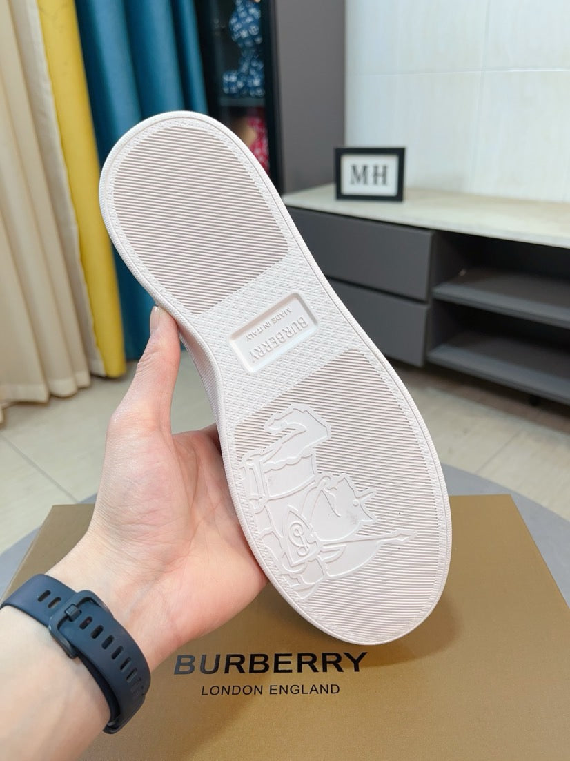 White sneaker outsole with embossed sailboat logo and textured grip tread