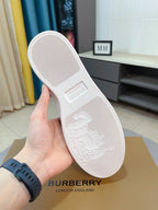 White sneaker outsole with embossed sailboat logo and textured grip tread