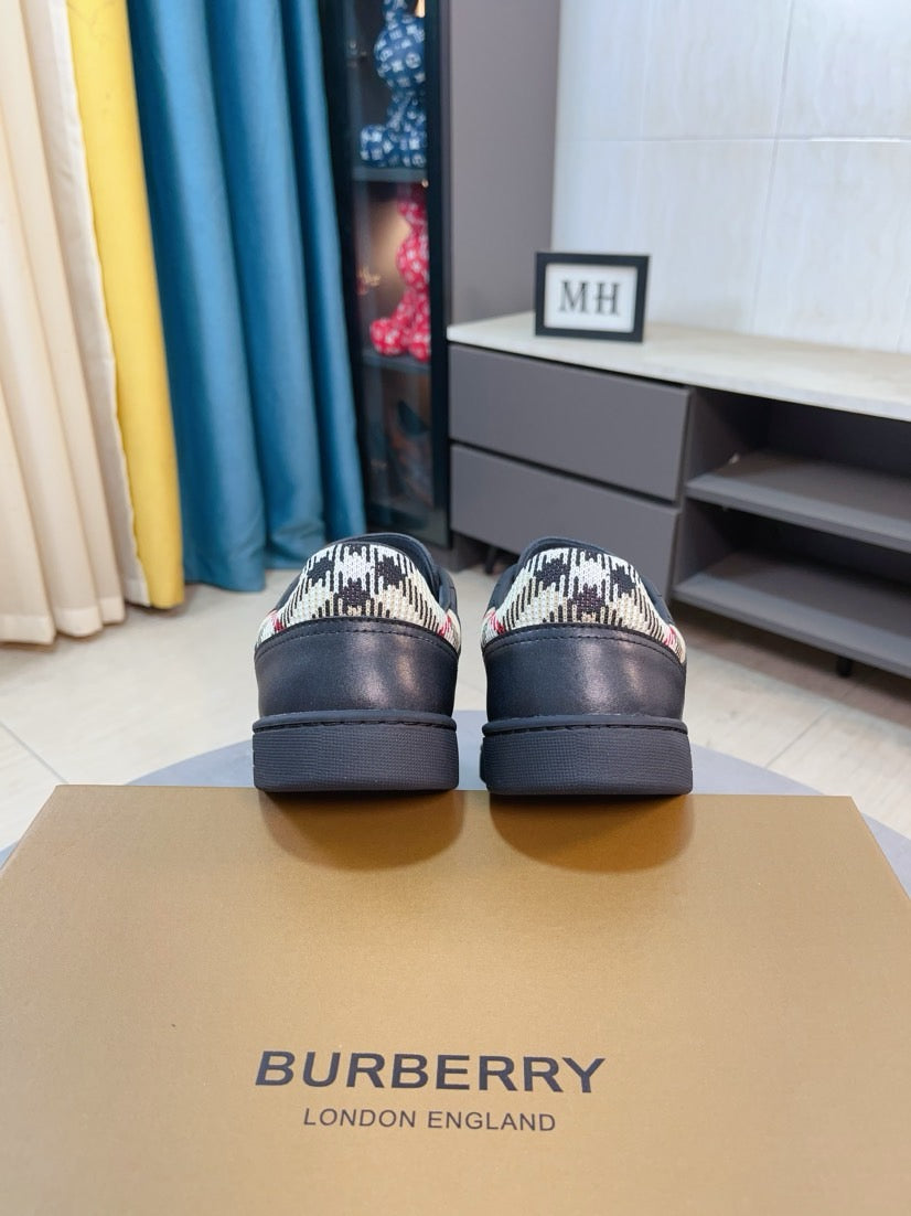 Back view of dark leather low-top sneakers with check-pattern heel panels
