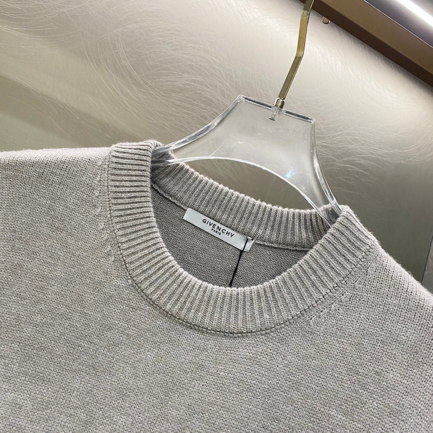 Givenchy knit sweater neckline detail with ribbed collar and inner label
