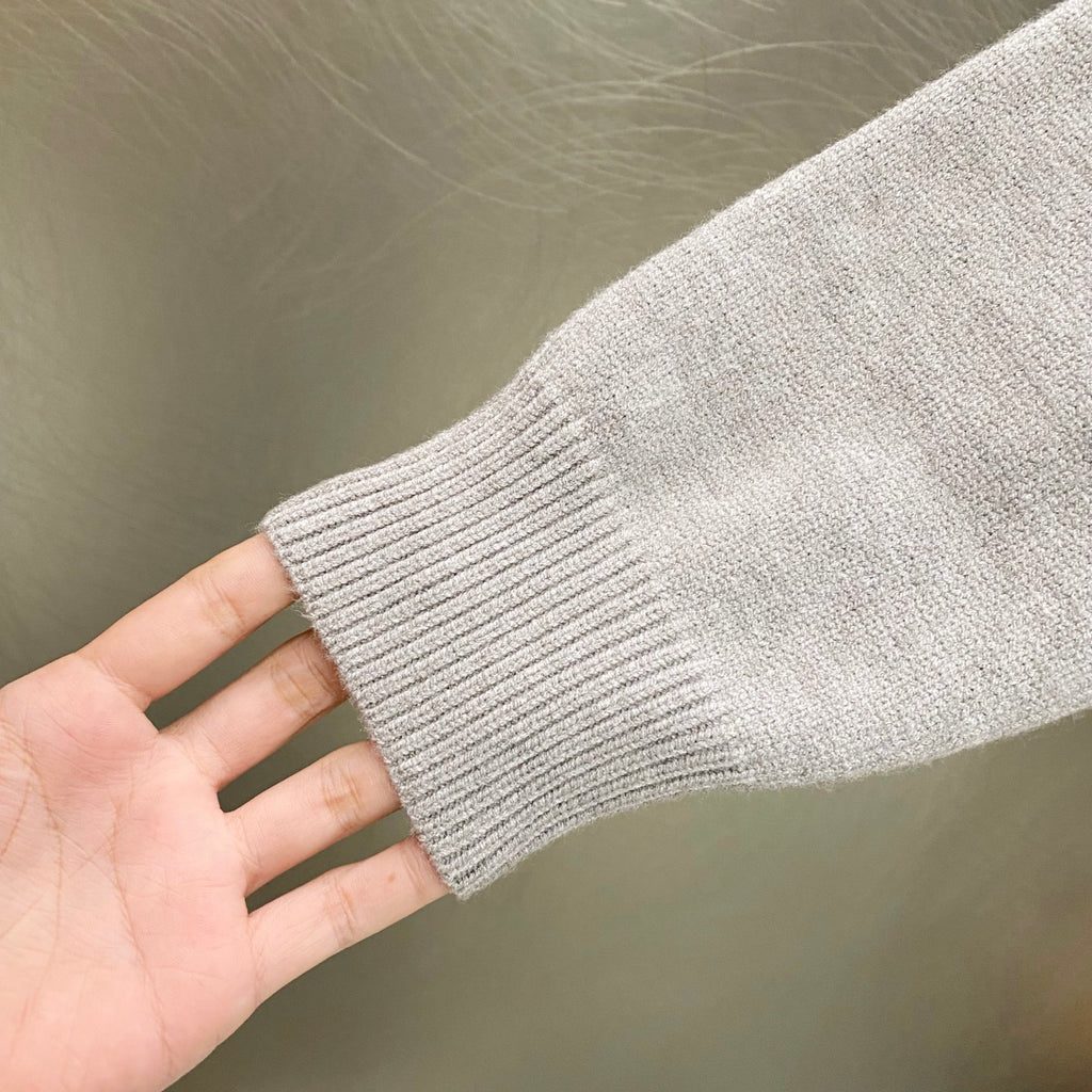 Givenchy knit sweater sleeve hem with ribbed cuff
