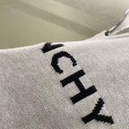 Givenchy knit sweater close-up of black logo graphic on fabric