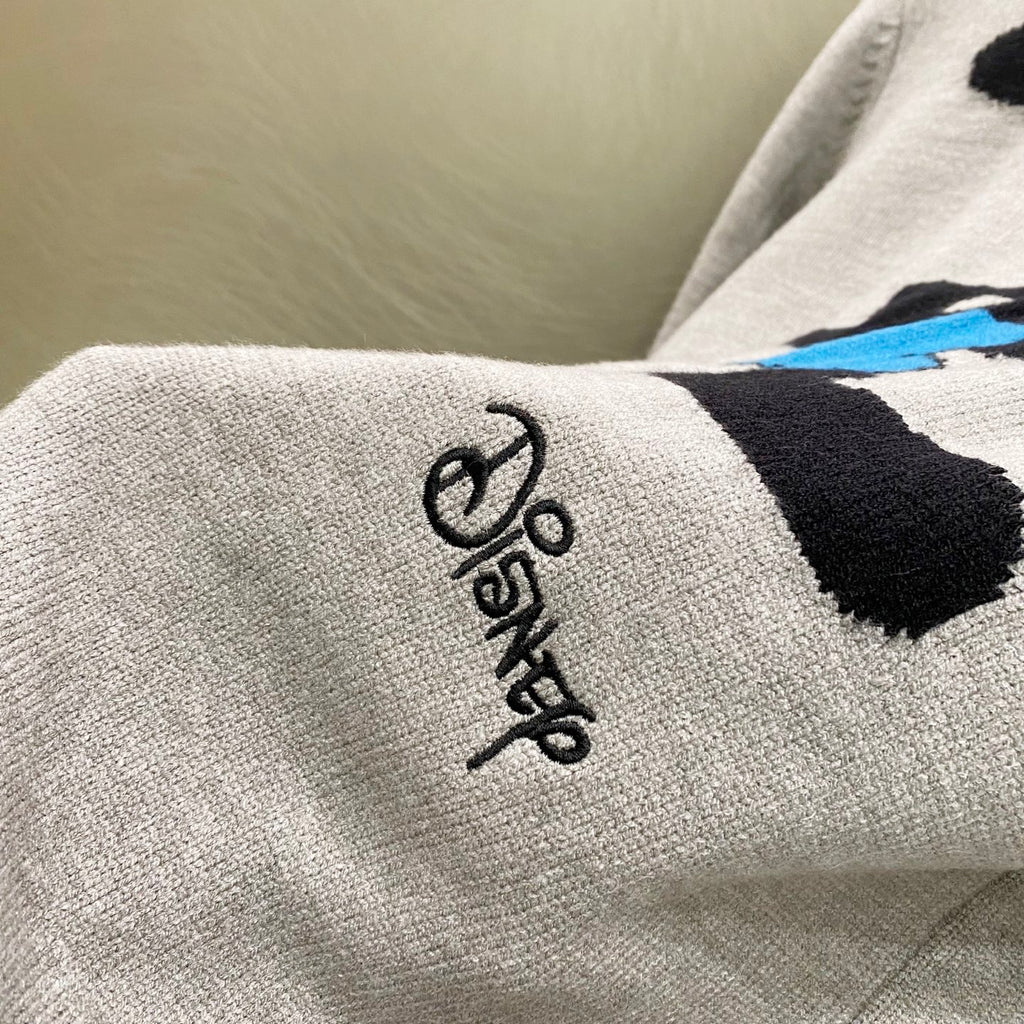 Givenchy knit sweater sleeve cuff with small black script logo detail