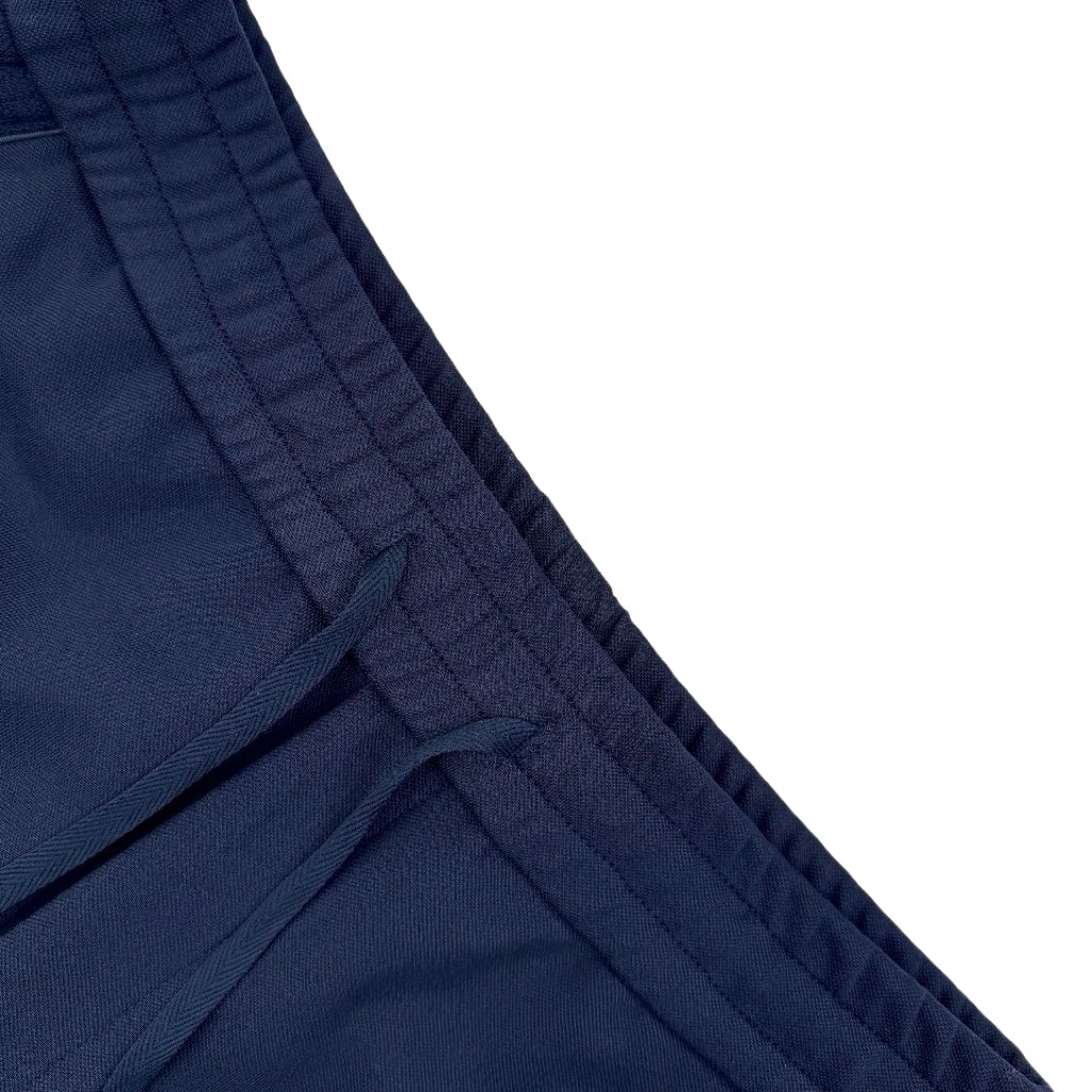 Close-up of navy waistband and drawstring with stitched panel detailing