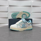 Amiri low-top sneakers, white with light blue accents and visible tread outsole