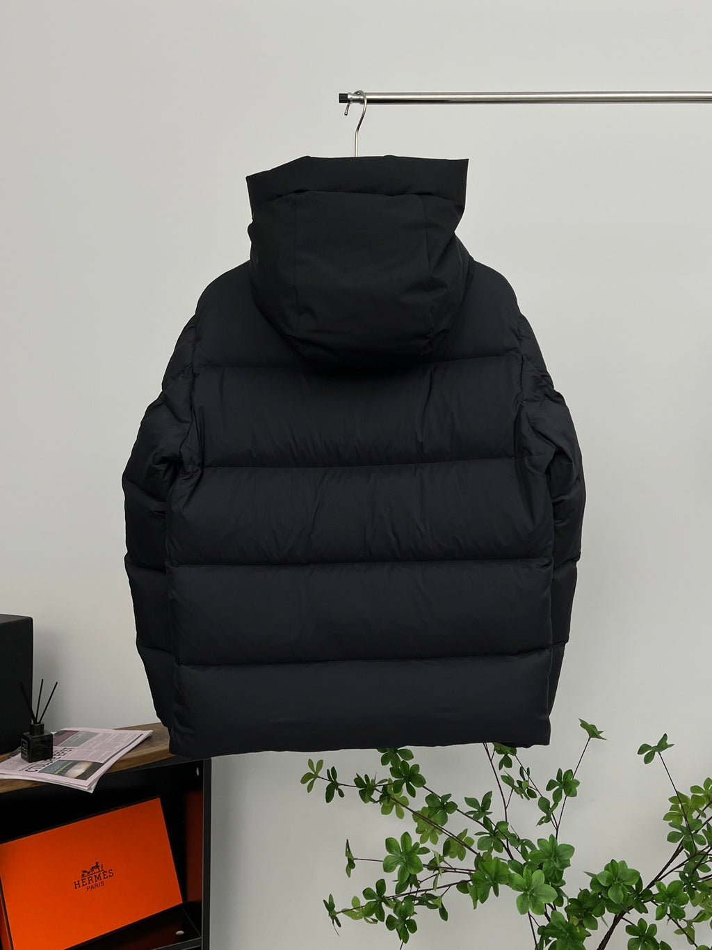 Moncler long hooded puffer jacket, black, back view with quilted paneling