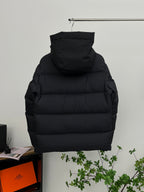 Moncler long hooded puffer jacket, black, back view with quilted paneling