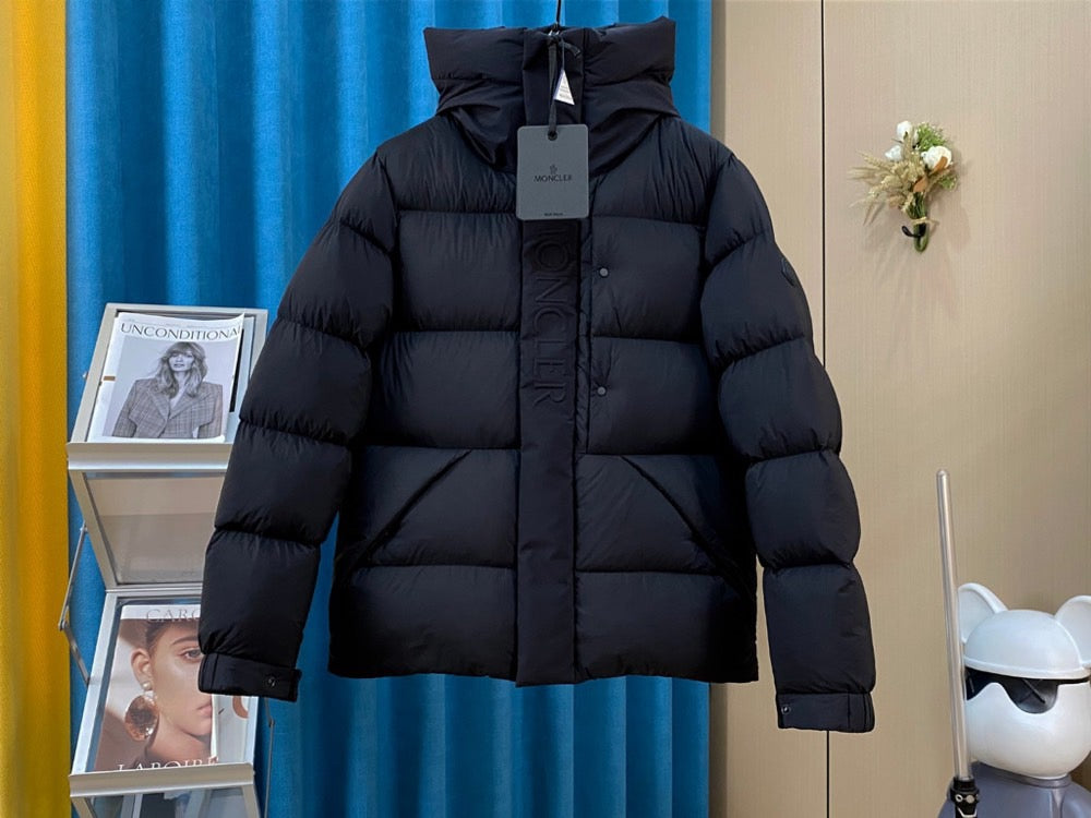 Moncler long hooded puffer jacket, dark, front view with zip and button placket