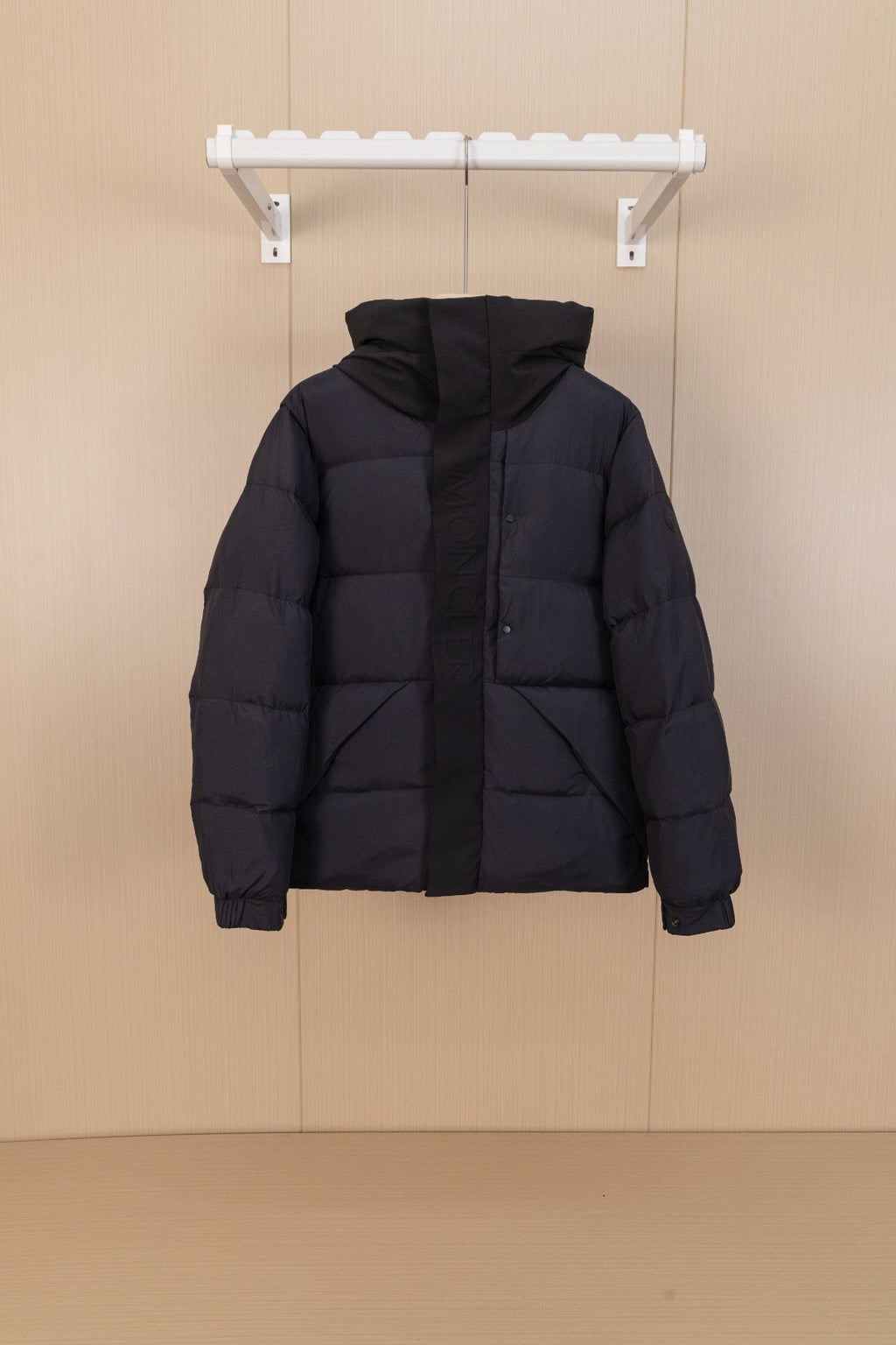 Moncler long hooded puffer jacket, black, front view on hanger