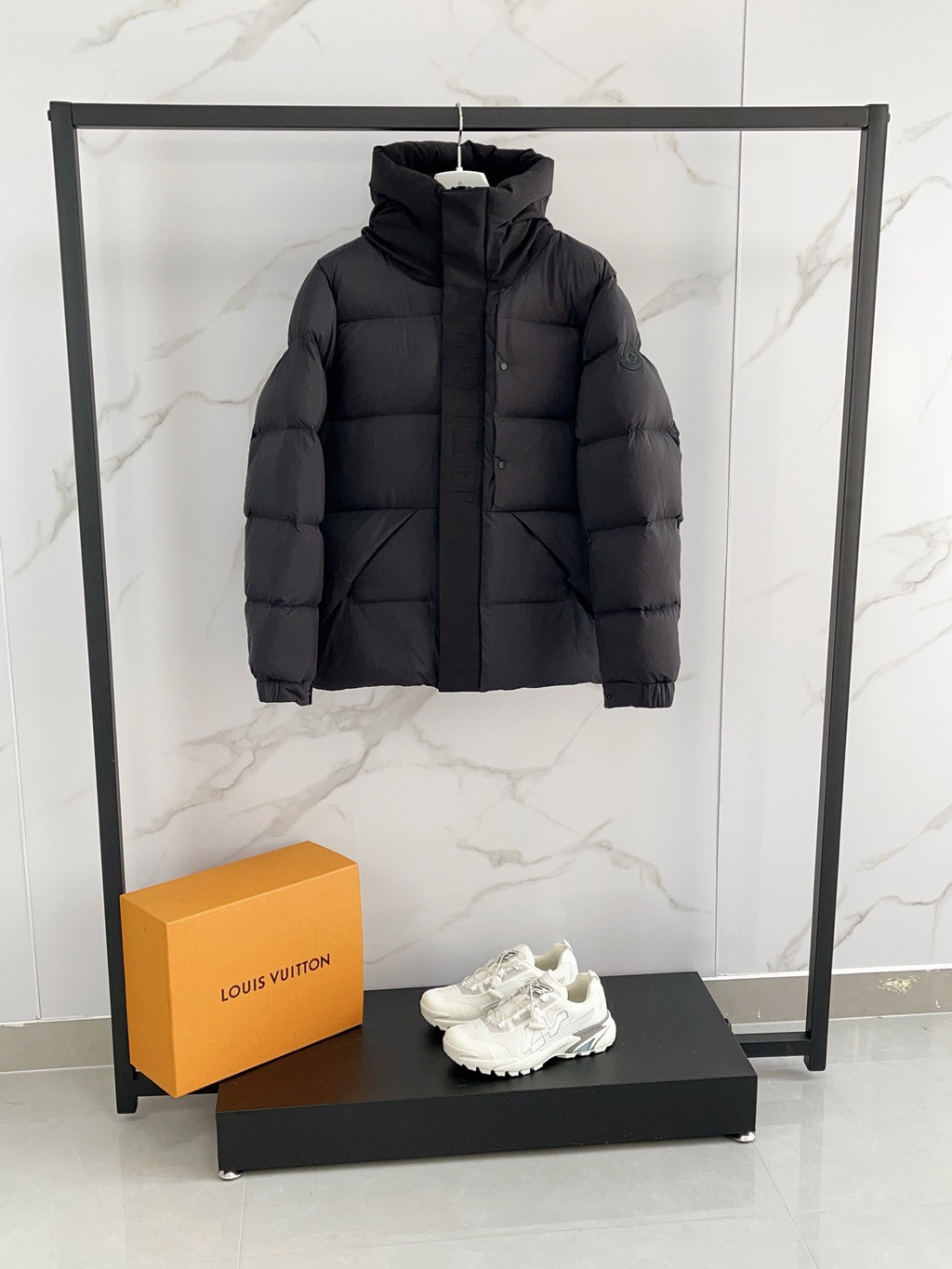 Moncler long hooded puffer jacket, black, front view, quilted padded design