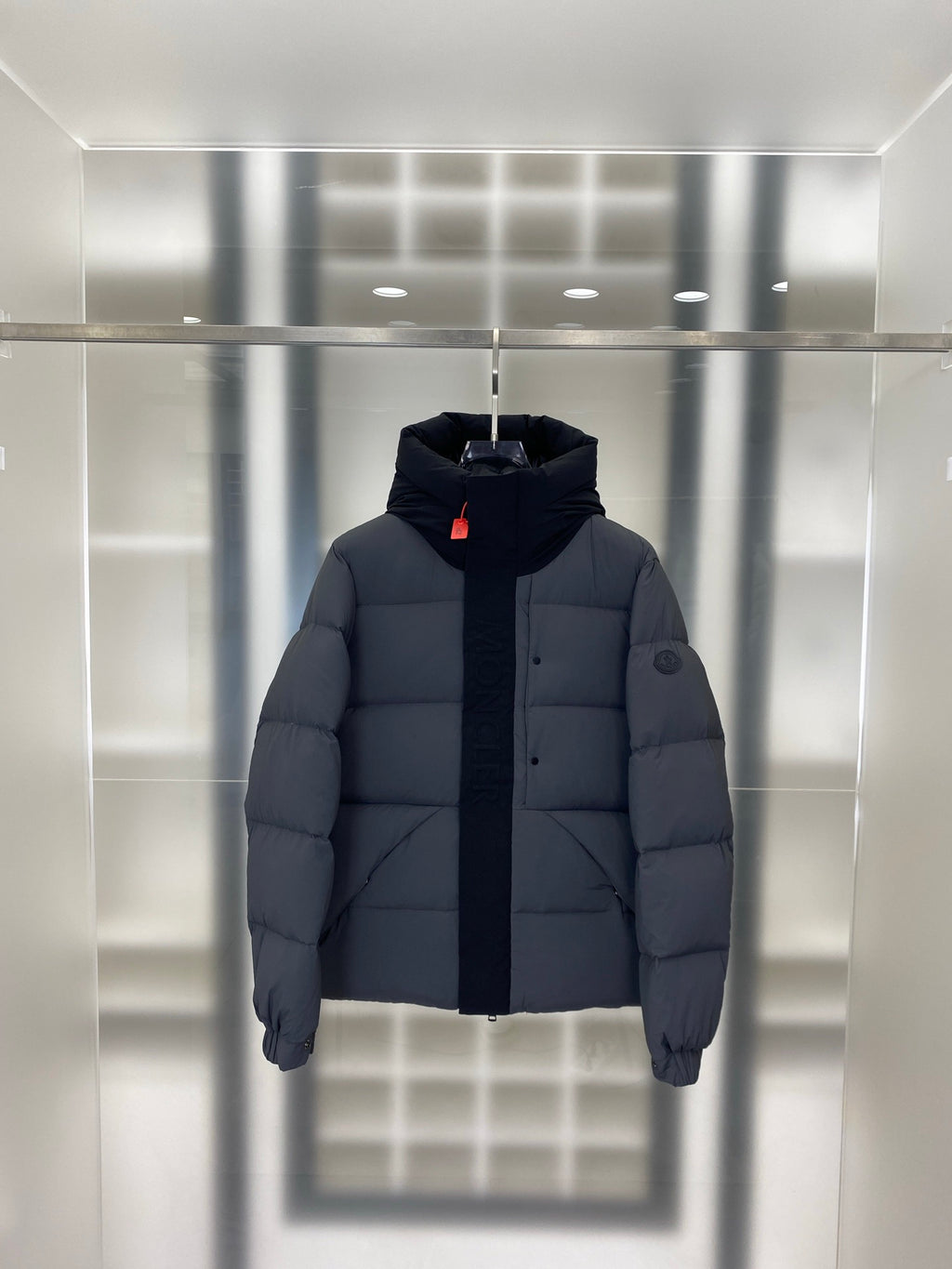 Moncler hooded puffer jacket, dark gray front view with quilted pattern