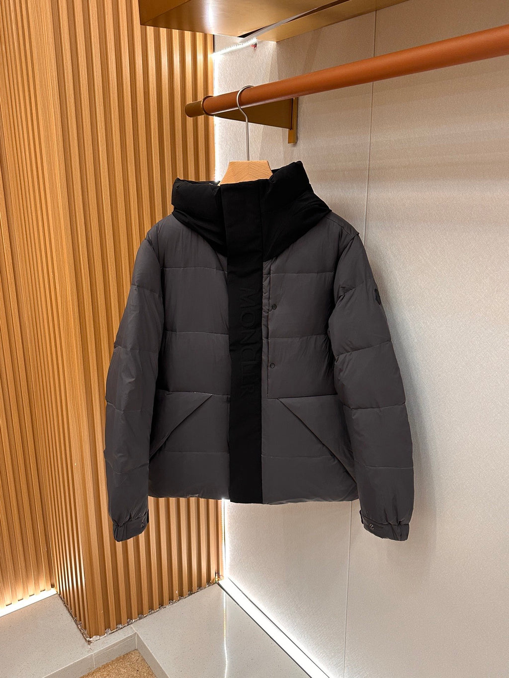 Long puffer jacket with hood, front view, dark gray quilted panels