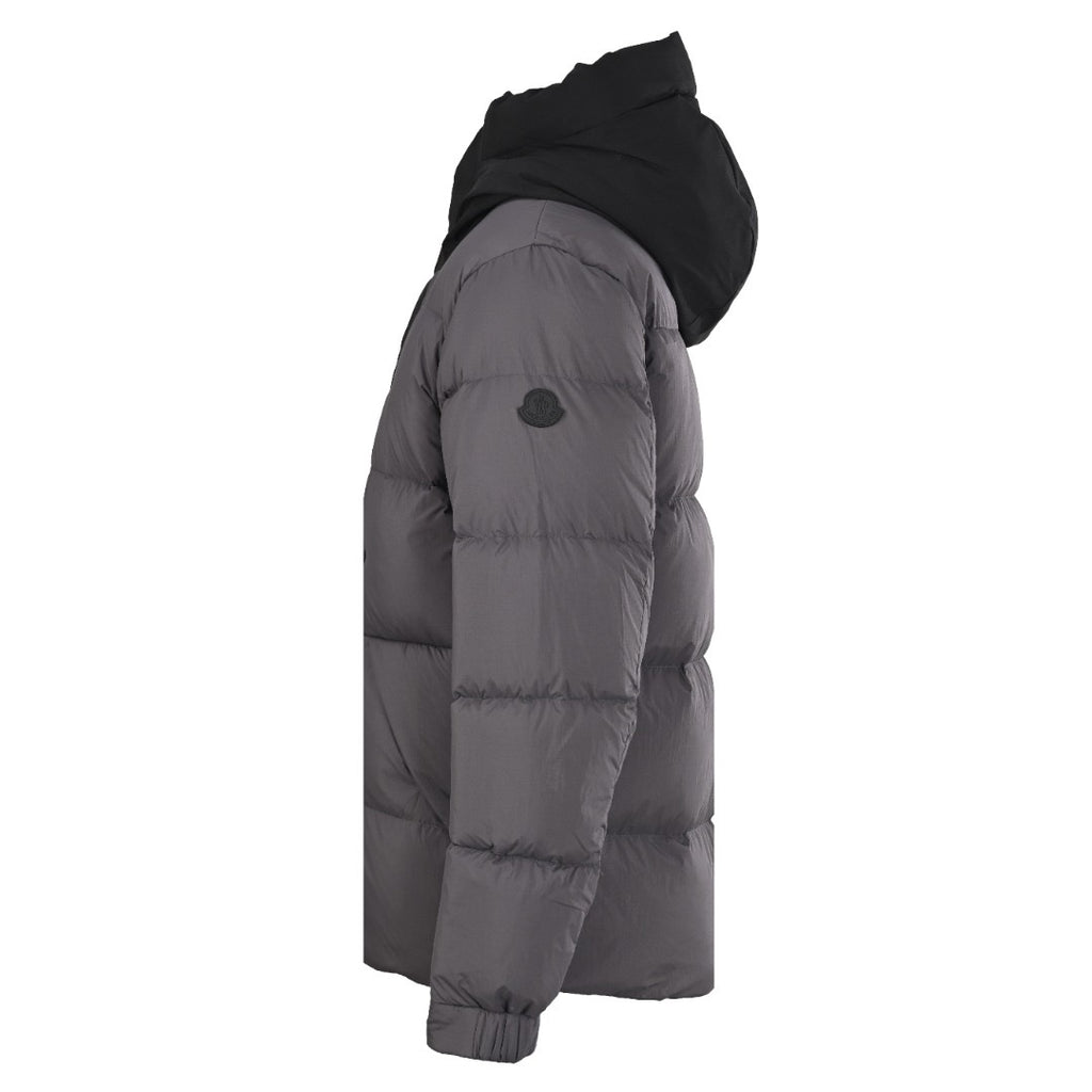Long hooded puffer jacket, side view, dark gray quilted insulation