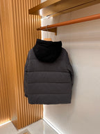 Long hooded puffer jacket, back view, dark gray puffer with quilted rows