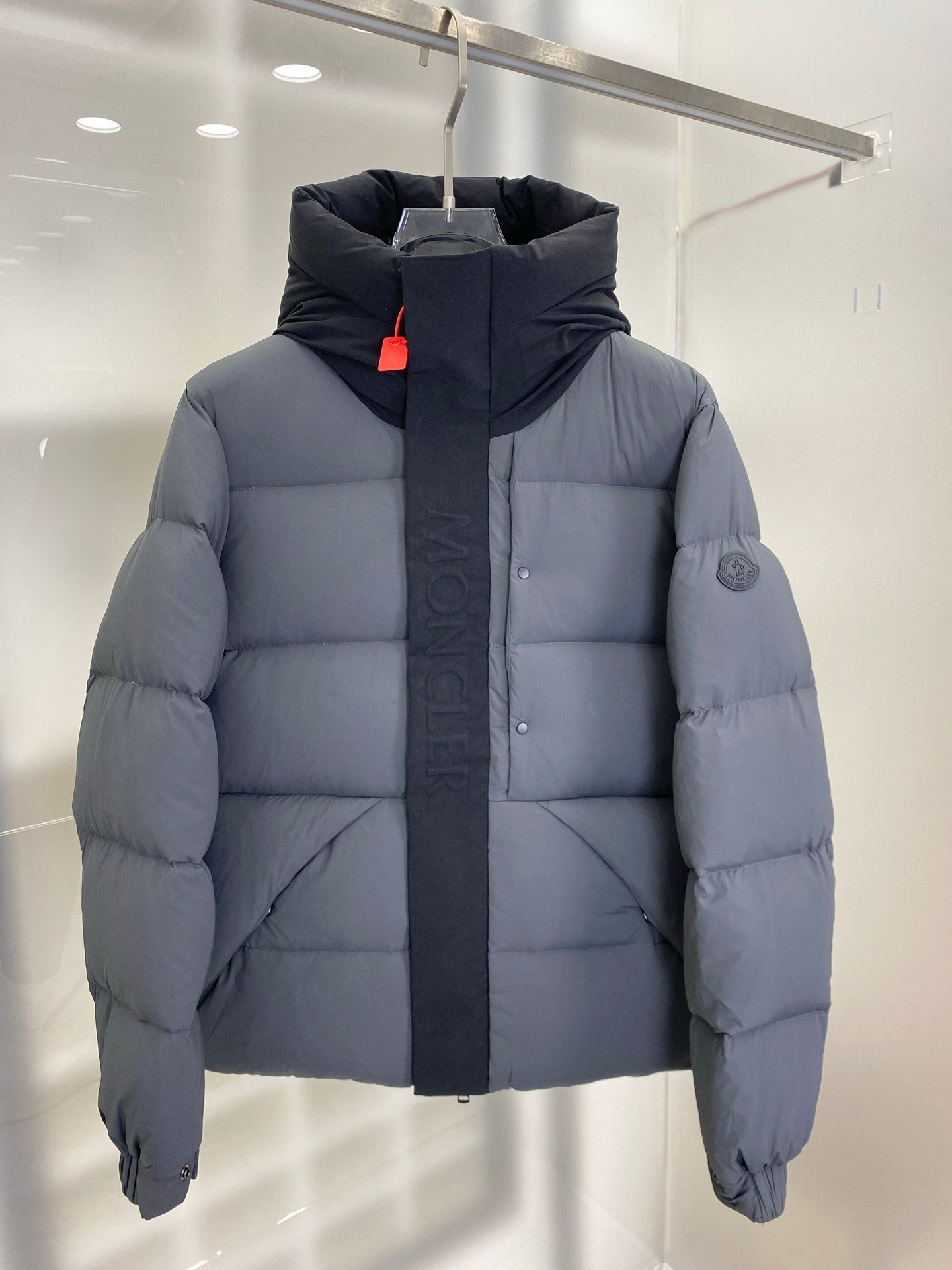 Moncler hooded puffer jacket, light gray front with hood and central zipper