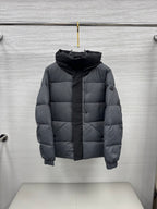 Moncler hooded puffer jacket, dark gray front on hanger with quilted panels