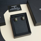 Chanel stud earrings set in black presentation box with certificate cards