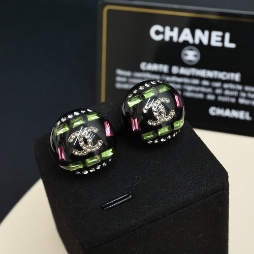 Chanel round stud earrings with black setting, green accents, and multicolor stones