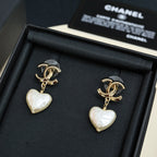 Gold-tone heart drop earrings with pearl-like white heart charms