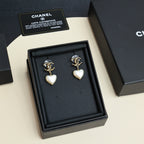 Gold-tone heart drop earrings with pearl-like white heart charms in gift box
