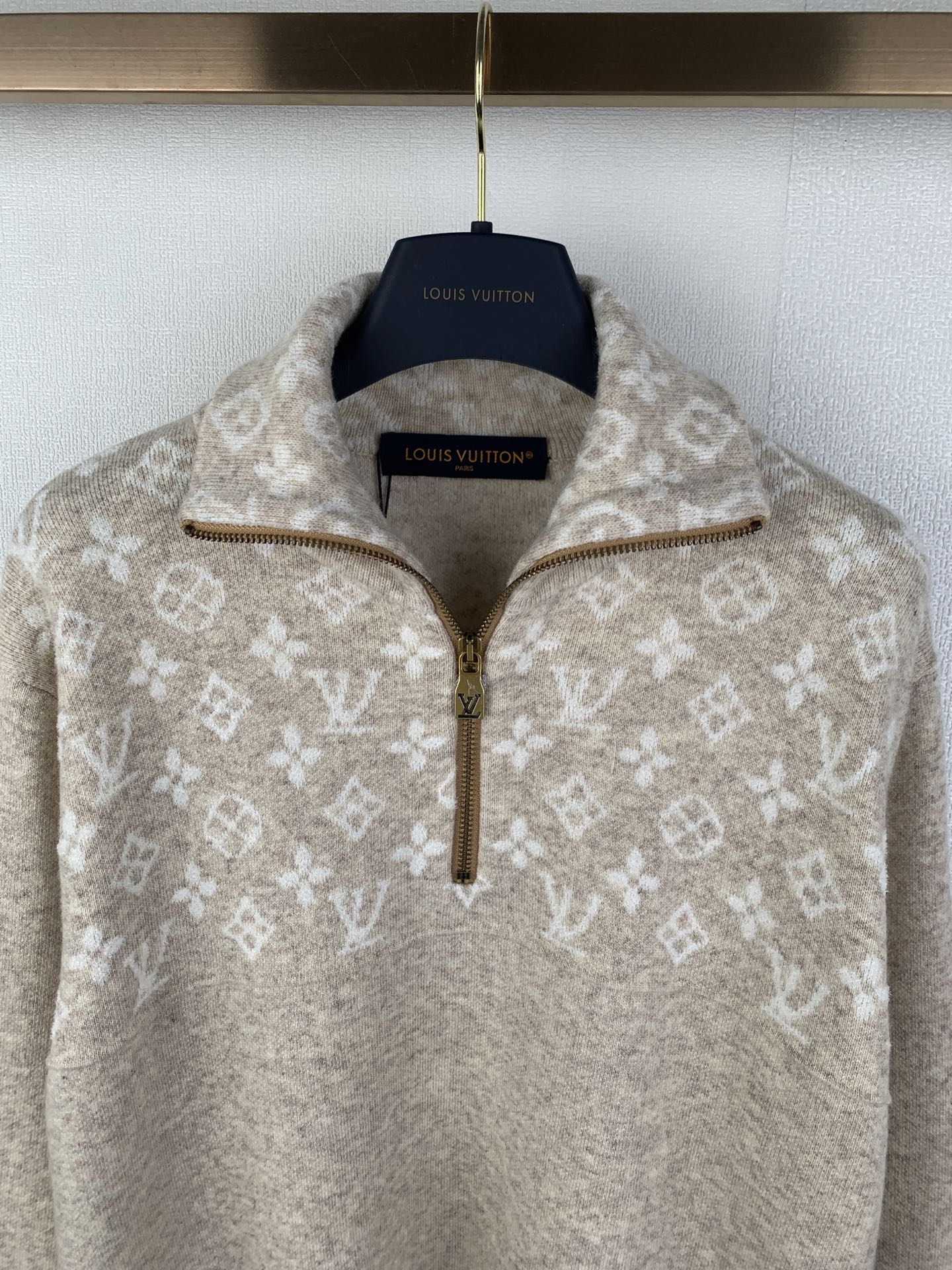 Half-zip sweater in light beige with allover monogram motifs and gold-tone zipper