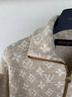 Zip sweater detail with beige monogram print, gold-tone zipper and stand collar