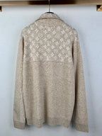 Back view of long-sleeve zip sweater in light beige with repeating monogram pattern