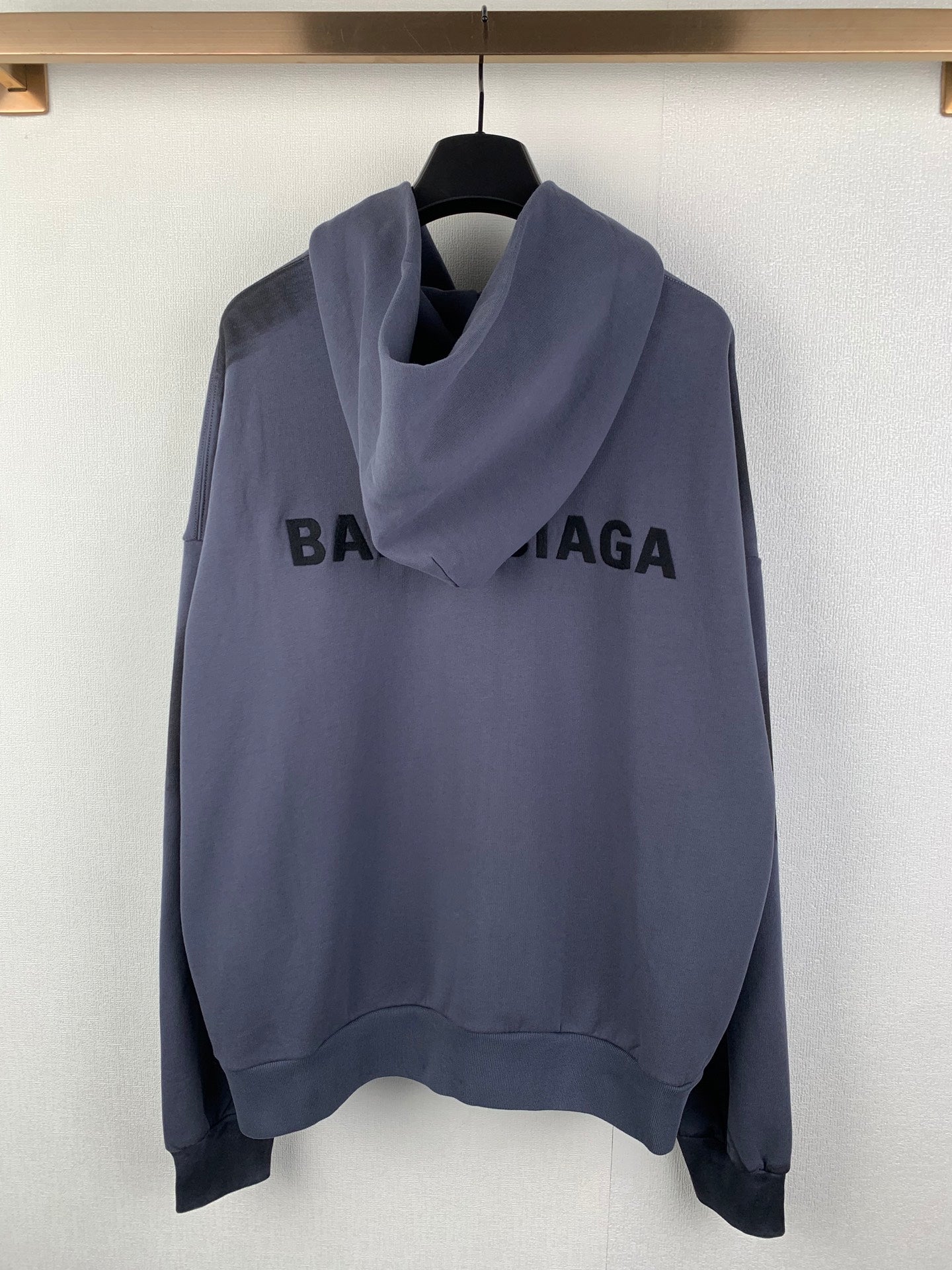 Balenciaga hooded sweatshirt with front zipper, dark blue, and large chest logo