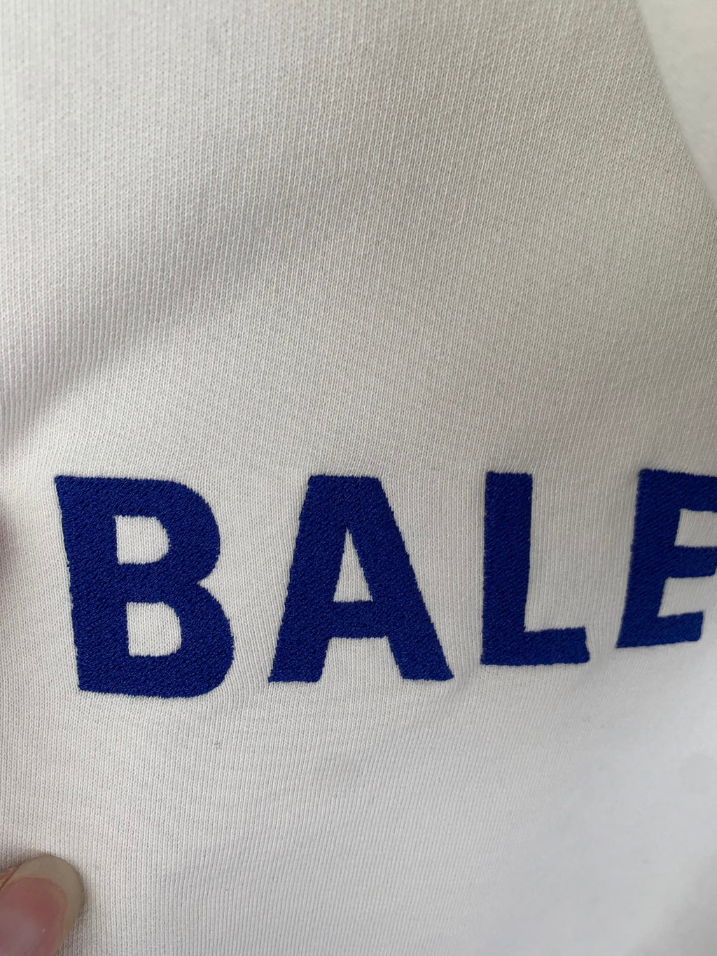 Cream hoodie knit with partial blue BALENCIAGA lettering