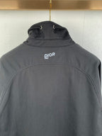 Dark gray Dior jacket back with stand collar and small DIOR 1947 logo