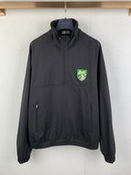 Black Dior zip-up jacket with stand collar, two front pockets, and logo patch