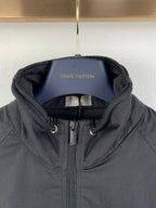 Dior hooded zip jacket with chin guard and adjustable draw cords at hood
