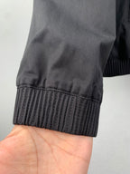 Elastic ribbed cuff on a dark gray jacket sleeve