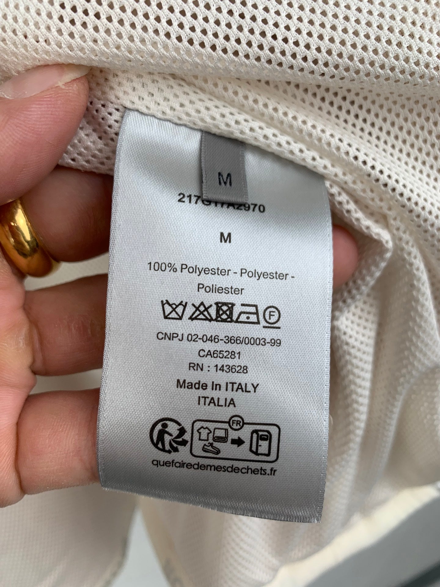 Cream sherpa long coat size and care label, 100% polyester