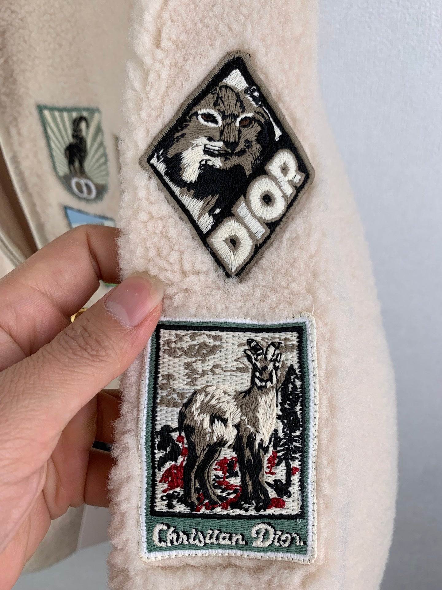 Cream sherpa long coat with Christian Dior patch and cartoon bear patch