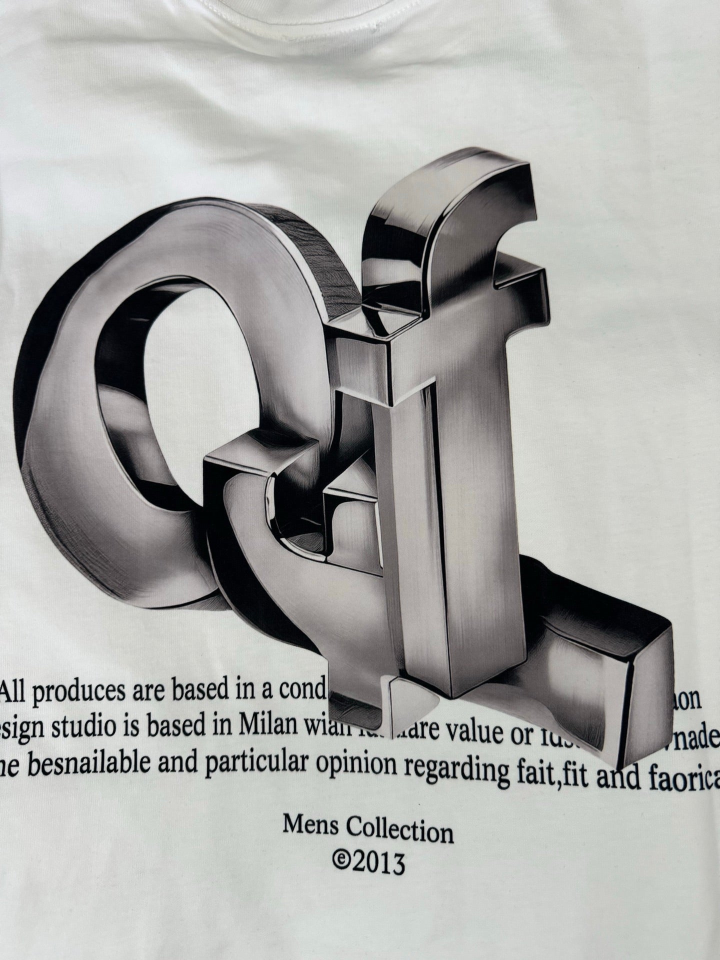 Off-white T-shirt close-up of metallic 3D logo with printed text below