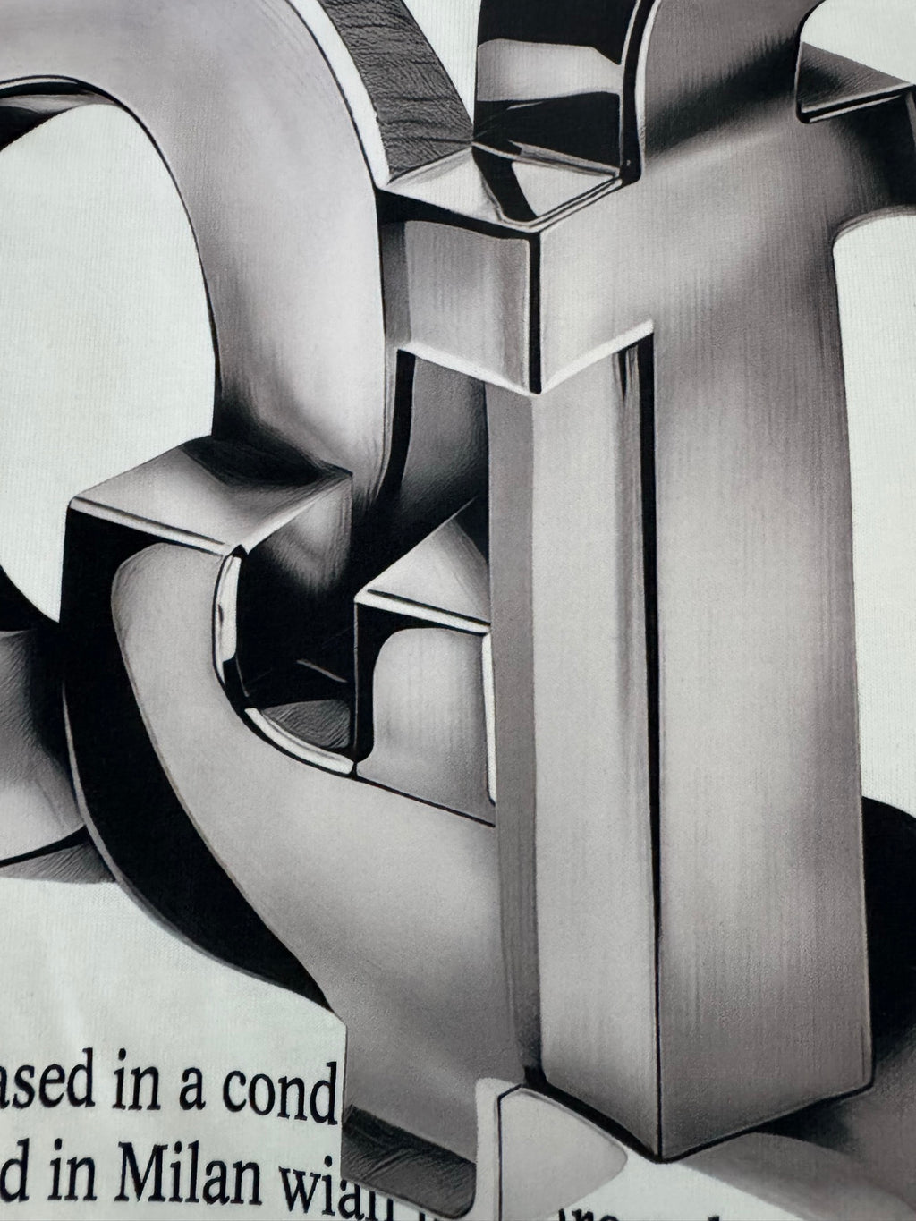 Metallic 3D logo print detail on off-white T-shirt