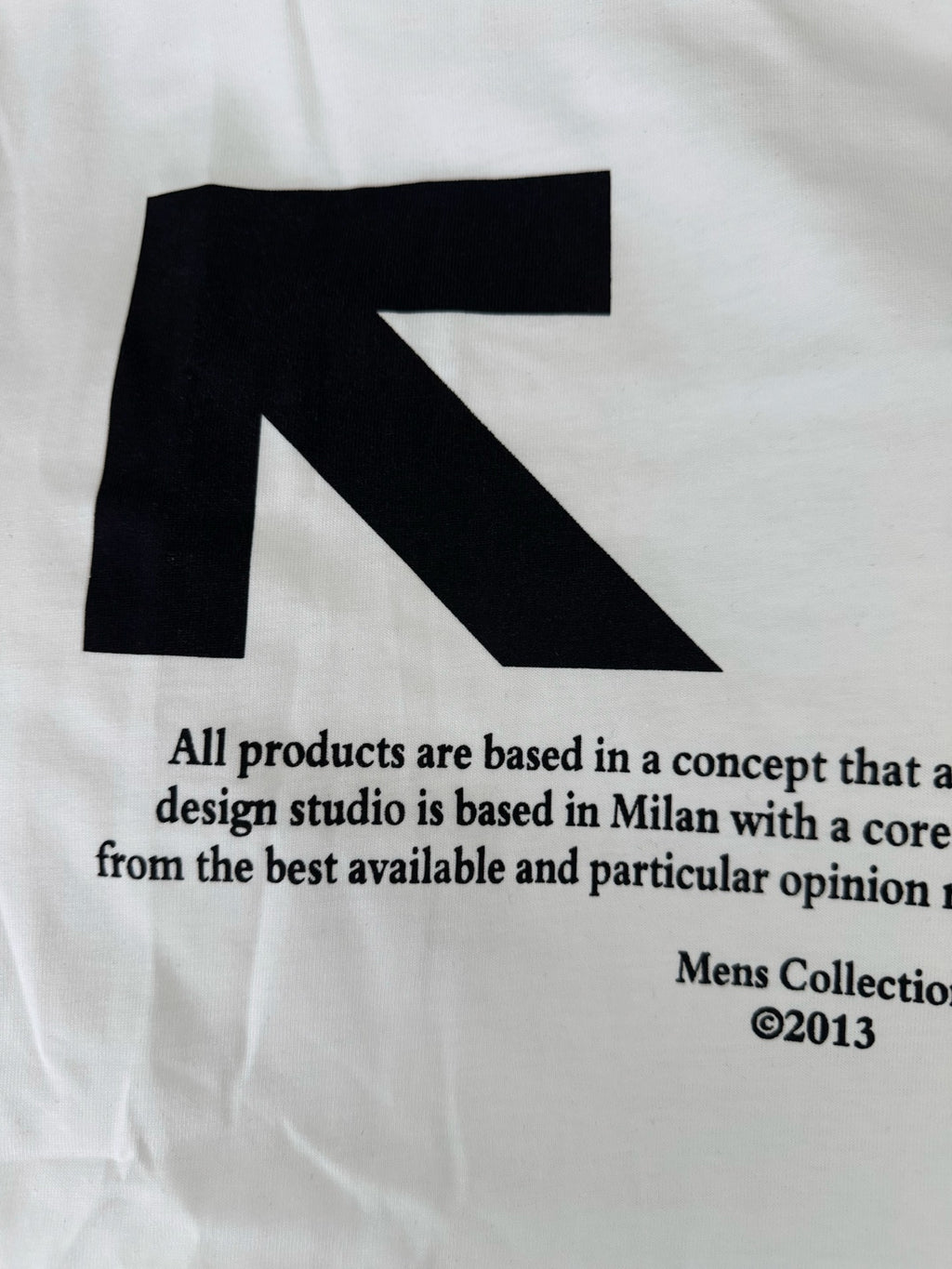 Off-White white T-shirt close-up of black arrow graphic and text