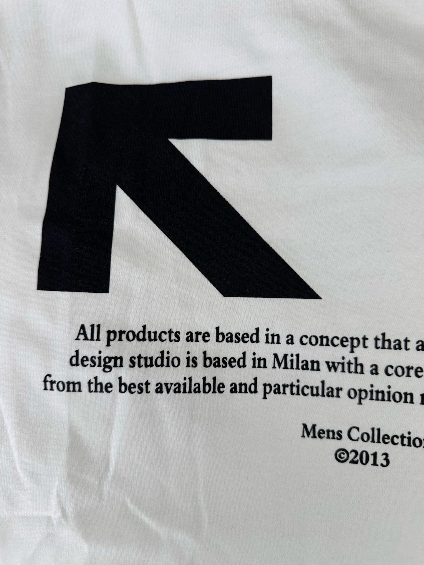 Off-White white T-shirt close-up of black arrow graphic and text