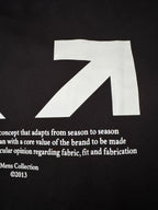 Black Off-White™ T-shirt close-up of white arrow graphic and text